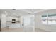 Open-concept kitchen and living area with natural light and modern finishes, great for entertaining at 3952 Big Sky Dr, Spring Hill, FL 34604