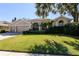 Attractive home with a 3-car garage and mature landscaping at 4324 Auston Way, Palm Harbor, FL 34685