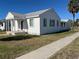 Side view of a white house with gray roof and multiple windows at 501 78Th Ave, St Pete Beach, FL 33706