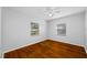 Bedroom with hardwood floors, ceiling fan and window at 7302 N Highland Ave, Tampa, FL 33604