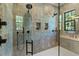 Spa-like shower with dual shower heads and built-in shelves at 809 W Amelia Ave, Tampa, FL 33602