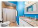 Bathroom with granite countertop and blue walls at 8376 Catamaran Cir, Lakewood Ranch, FL 34202