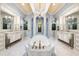 Spacious bathroom with double vanities, a soaking tub, and a walk-in shower at 8376 Catamaran Cir, Lakewood Ranch, FL 34202