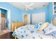 Bedroom with light blue walls and beach themed decor at 8376 Catamaran Cir, Lakewood Ranch, FL 34202