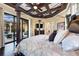 Main bedroom with large bed and views of the pool and patio at 8376 Catamaran Cir, Lakewood Ranch, FL 34202