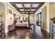Spacious main bedroom with a large bed, sitting area, and dark hardwood floors at 8376 Catamaran Cir, Lakewood Ranch, FL 34202