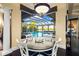 Casual dining area with pool and patio views, perfect for entertaining at 8376 Catamaran Cir, Lakewood Ranch, FL 34202