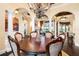 Bright dining room with a round table, and views into the living room and kitchen at 8376 Catamaran Cir, Lakewood Ranch, FL 34202