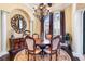 Formal dining room with a round table, ornate chairs, and a stunning chandelier at 8376 Catamaran Cir, Lakewood Ranch, FL 34202
