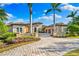 Luxury home showcasing Mediterranean architecture and landscaping at 8376 Catamaran Cir, Lakewood Ranch, FL 34202