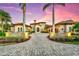 Stunning home exterior at sunset, showcasing curb appeal at 8376 Catamaran Cir, Lakewood Ranch, FL 34202