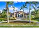 Beautiful home with palm trees and a large driveway at 8376 Catamaran Cir, Lakewood Ranch, FL 34202