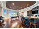 Game room features wet bar, pool table, and lake views at 8376 Catamaran Cir, Lakewood Ranch, FL 34202