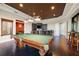 Game room with pool table and adjacent bar area at 8376 Catamaran Cir, Lakewood Ranch, FL 34202