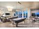 Spacious game room featuring a pool table and comfortable seating at 8376 Catamaran Cir, Lakewood Ranch, FL 34202