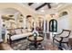Spacious living room with hardwood floors, comfortable seating, and an open floor plan at 8376 Catamaran Cir, Lakewood Ranch, FL 34202