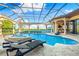 Resort-style pool and spa with a covered patio, perfect for relaxation at 8376 Catamaran Cir, Lakewood Ranch, FL 34202