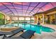 Enclosed pool and spa with covered patio and seating at 8376 Catamaran Cir, Lakewood Ranch, FL 34202