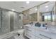Double vanity bathroom with a large shower and modern fixtures at 900 Cove Cay Dr # 2B, Clearwater, FL 33760