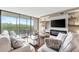 Bright living room with comfortable seating and balcony access at 900 Cove Cay Dr # 2B, Clearwater, FL 33760