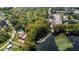 Aerial view of community with lakefront pool and dock at 919 Hickory Hill Ct, Palm Harbor, FL 34684