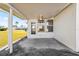 Covered back patio with concrete flooring and ceiling fan at 9201 40Th N Way, Pinellas Park, FL 33782