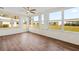 Bright and airy Florida room with wood-look flooring and large windows at 9201 40Th N Way, Pinellas Park, FL 33782