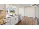 Updated kitchen with white shaker cabinets, granite countertops, and stainless steel appliances at 9201 40Th N Way, Pinellas Park, FL 33782