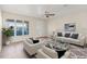 Bright living room with large windows and stylish furniture at 9201 40Th N Way, Pinellas Park, FL 33782