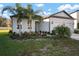 House with two-car garage and neatly landscaped yard at 12907 Brookside Moss Dr, Riverview, FL 33579