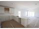 Modern kitchen featuring white cabinets and quartz countertops at 3430 Sarto Ln, Rotonda West, FL 33947