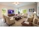 Comfortable living room with ample seating and large TV at 3430 Sarto Ln, Rotonda West, FL 33947