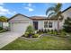 Single-Gathering home with landscaped yard and two-car garage at 1003 Tidal Rock Ave, Ruskin, FL 33570