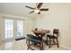 Cozy breakfast nook with table and chairs, near French doors at 10111 Lazy Creek Ct, Tampa, FL 33615