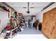 Garage with storage shelving and various items at 10111 Lazy Creek Ct, Tampa, FL 33615