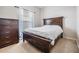 Bedroom with dark wood furniture and carpeted floor at 10633 Weeping Elm Bnd, Land O Lakes, FL 34638