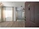 Light-filled living room showcasing wood floors and a view into the main living space at 10764 70Th Ave # 6107, Seminole, FL 33772