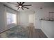 Open concept space boasts wood floors, breakfast bar, and lots of natural light at 10764 70Th Ave # 6107, Seminole, FL 33772