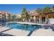 Community pool with lounge chairs at 10764 70Th Ave # 6107, Seminole, FL 33772