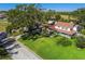Two-story house with large yard and red roof at 11114 Lake Sassa Dr, Thonotosassa, FL 33592