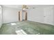 Green carpeted bedroom with ceiling fan and window at 11114 Lake Sassa Dr, Thonotosassa, FL 33592