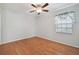 Spacious bedroom with hardwood floors and ceiling fan at 11114 Lake Sassa Dr, Thonotosassa, FL 33592