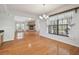Open dining room with hardwood floors and views into Gathering room at 11114 Lake Sassa Dr, Thonotosassa, FL 33592