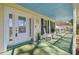 Front porch with rocking chairs and a porch swing, offering a relaxing outdoor space at 11114 Lake Sassa Dr, Thonotosassa, FL 33592