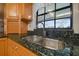 Kitchen sink with double basin and granite countertop at 11114 Lake Sassa Dr, Thonotosassa, FL 33592