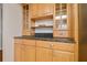 Built-in hutch with glass doors and granite countertop at 11114 Lake Sassa Dr, Thonotosassa, FL 33592