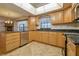 Bright kitchen with granite countertops, stainless steel appliances, and light wood cabinets at 11114 Lake Sassa Dr, Thonotosassa, FL 33592