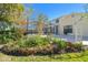 Landscaped backyard with lush greenery and a garden area at 11114 Lake Sassa Dr, Thonotosassa, FL 33592