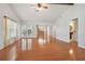 Bright living room with hardwood floors and view of kitchen at 11114 Lake Sassa Dr, Thonotosassa, FL 33592