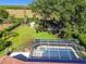 Enclosed pool and spa with tiled deck at 11114 Lake Sassa Dr, Thonotosassa, FL 33592